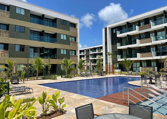 Flat ESTUDIO de LUXO - Praia de Muro Alto - Piscinas - Ideal para CASAIS, famílias com crianças - ap COMPLETO - AR COND, WI FI, NETFLIX, ESTACIONAMENTO - 400 mt do MAR Pôrto das Galinhas